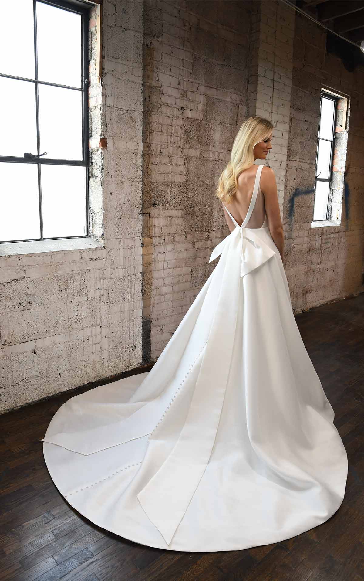 1275 Clean Modern Ballgown with Wide Straps and Bow by Martina Liana
